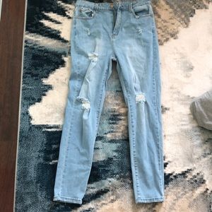 Fashion Nova light blue skinny jeans with rips